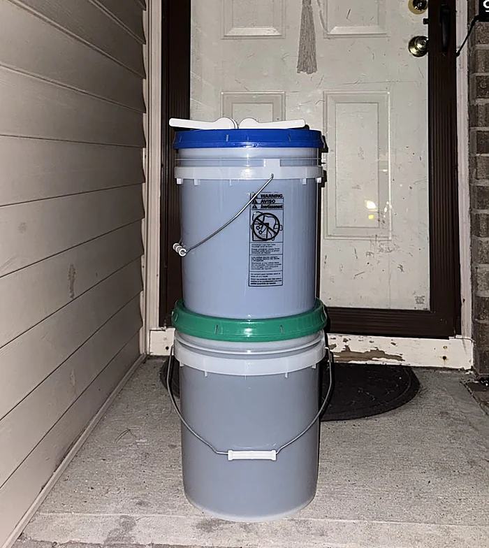 Two buckets delivered to a customer's front door