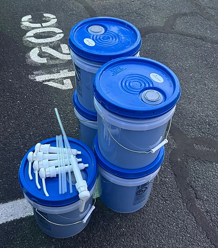 Blue buckets with pumps ready to go